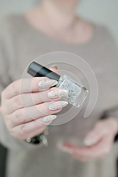 beautiful female hands with long nails light pale white manicure