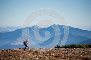 Beautiful female hiker enjoying beautiful nature landscape
