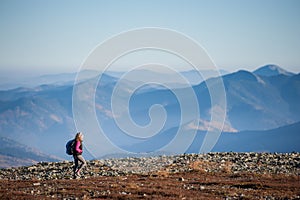 Beautiful female hiker enjoying beautiful nature landscape