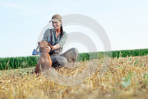 Beautiful female hunter with furry companion.