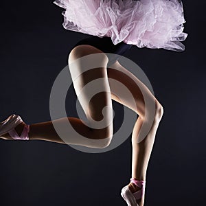 Beautiful female legs.ballet dancer girl.Ballerina pointe shoes