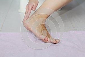 Beautiful female legs, heels, feet. Foot care, massage, spa. Heel care.