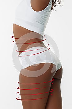 Beautiful female legs and hips, buttocks on white background. Beauty, cosmetics, spa, bodycare and lifting, correction