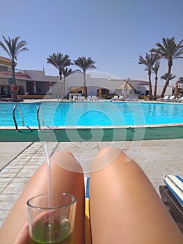 Beautiful female legs at the pool.