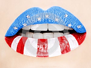 Beautiful female lips painted with American flag