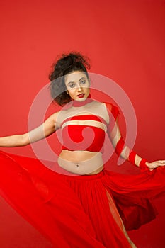 Beautiful female model in a flowy red dress
