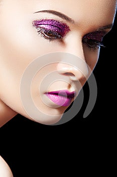 Beautiful female model, violet glitter eye-make-up