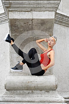 Beautiful female modern dancer performing outdoors