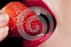 Beautiful Female Mouth Eating A Strawberry