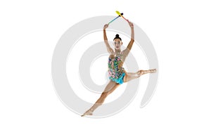 Beautiful female rhythmic gymnast with clubs in motion and action isolated white studio background.