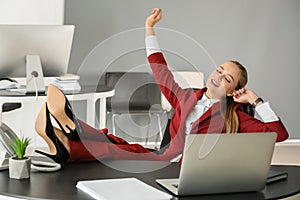 Beautiful female secretary resting at workplace