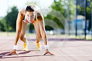 Female sprinter getting ready for the run