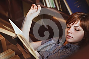 Beautiful female student in a university library