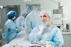 Beautiful female surgeon having a rest after operation