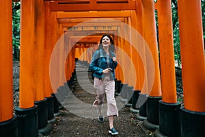 Beautiful female traveler smiling joyfully