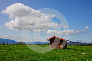 Beautiful fields and cottages under the blue cloudy sky