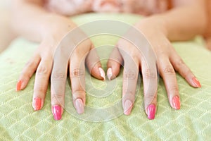 Beautiful fingernail manicure acrylic nail polish of woman