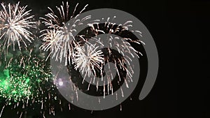 Beautiful fireworks flowers on the night sky. Brightly blue fireworks on dark black color background. Holiday relax time