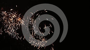 Beautiful fireworks flowers on the night sky. Brightly blue fireworks on dark black color background. Holiday relax time