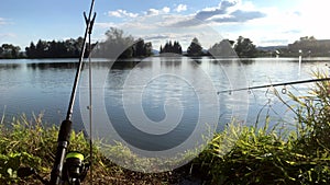 Beautiful fish pond near Badin, Banska Bystrica, Slovakia. Sky and trees mirror reflection in the water. Fishing place.