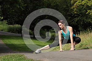 Beautiful fit athletic woman warm up stretch