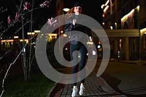 Beautiful Fitness Woman in Black Athletic Wear Jogging On Street Alone, Night