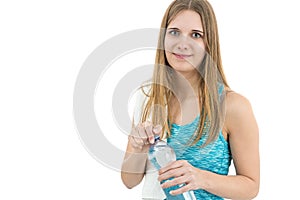 Beautiful fitness woman holding a bottle of water