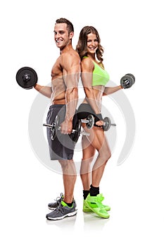 Beautiful fitness young sporty couple with dumbbell photo