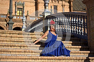 The beautiful flamenco dress sitting on the stairs photo
