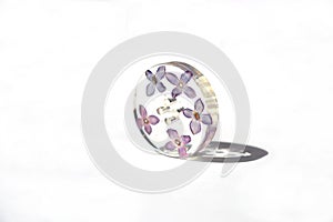 Beautiful floral button, epoxy resin flowers of lilac.