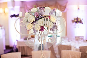 Beautiful floral centerpiece at wedding reception table closeup