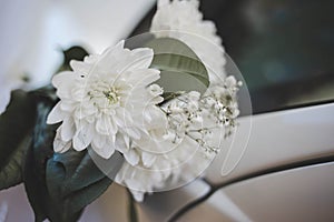 Beautiful floral decoration on a wedding car