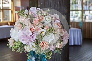 Beautiful flower arrangements in glass vases are on the table