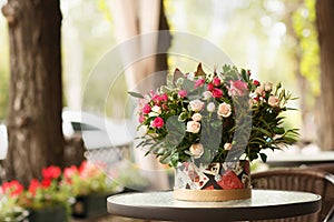 Beautiful flower blossom in a bouquet on a florist shop background. Romantic present concept. Copy space.