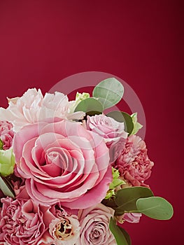 Beautiful flower box on red background, bouquet of blooming flowers as holiday gift, luxury floral design