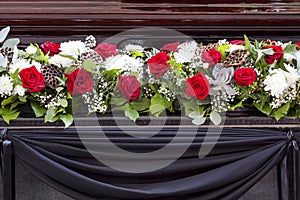 Beautiful flower decoration of the coffin. Funeral, farewell ceremony