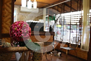 Beautiful flower on the table at the coffee shop.