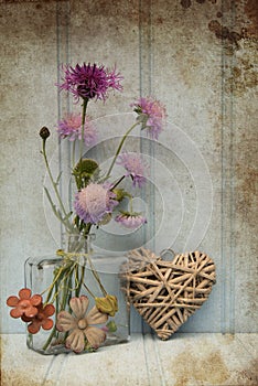 Beautiful flower in vase with heart still life love concept