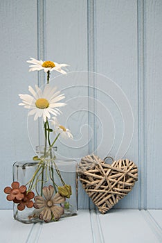 Beautiful flower in vase with heart still life love concept