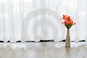 Beautiful flower vase on white drape background.