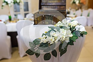 Beautiful flowers on elegant dinner table in wedding day. Decorations served on the festive table in blurred background