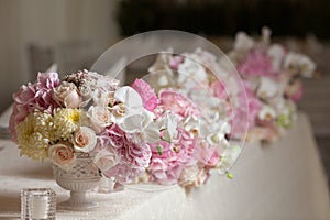 Beautiful flowers on table in wedding day. Luxury holiday background.