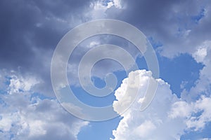 Beautiful fluffy clouds on light blue sky as background