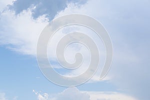 Beautiful fluffy clouds on light blue sky as background