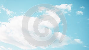 Fluffy white cloud on the blue aquamarine color sky background. 16:9