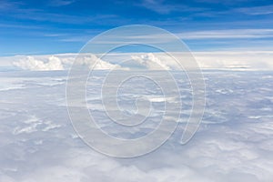 Beautiful fluffy white cumulus clouds on blue sky background.