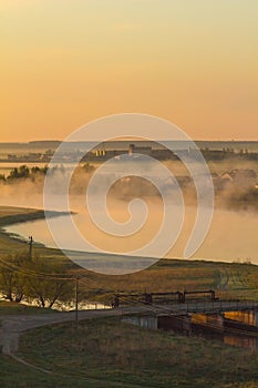 Beautiful foggy morning in a rural field