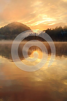 Beautiful foggy sunrise the Bled lake on autumn