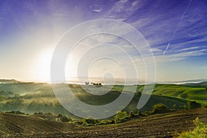 Beautiful foggy sunrise landscape in Tuscany, Italy