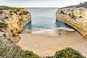 Beautiful Fontainhas Beach surrounded by yellow cliffs, Algarve, Portugal